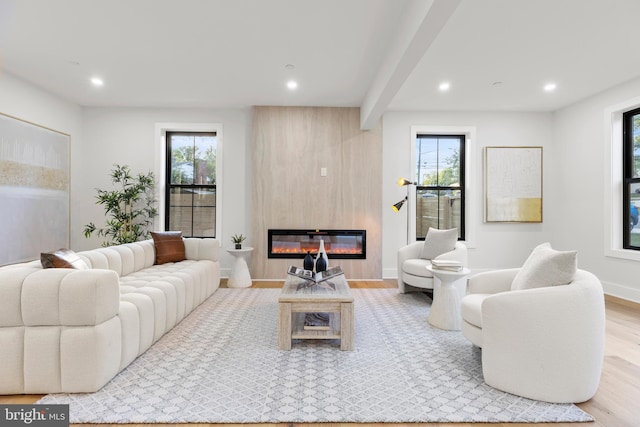 8206 Grubb Rd, Chevy Chase, MD 20815 - living room with wood finished floors, a large fireplace, plenty of natural light, recessed lighting, and baseboards