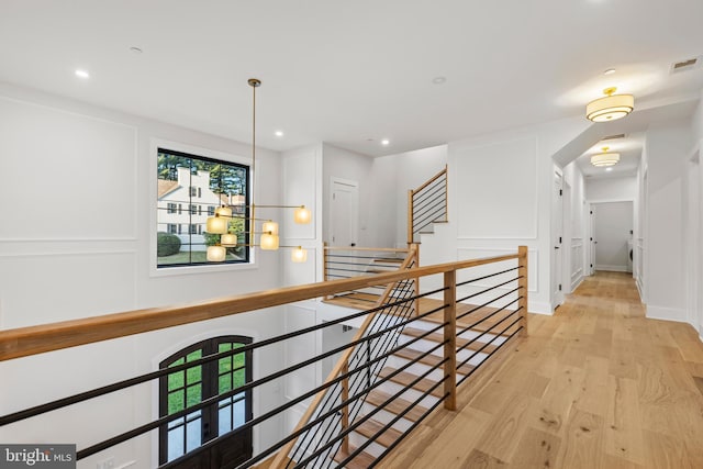 8206 Grubb Rd, Chevy Chase, MD 20815 - corridor featuring light wood finished floors, recessed lighting, and an upstairs landing