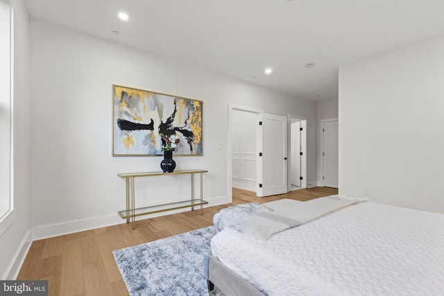 8206 Grubb Rd, Chevy Chase, MD 20815 - bedroom with wood finished floors, recessed lighting, and baseboards