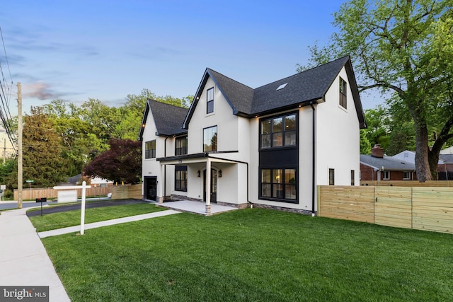 8206 Grubb Rd, Chevy Chase, MD 20815 - back of house featuring stucco siding, roof with shingles, and a patio