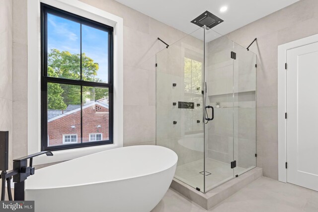 8206 Grubb Rd, Chevy Chase, MD 20815 - full bathroom featuring a freestanding tub, healthy amount of natural light, and a stall shower