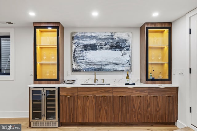 8206 Grubb Rd, Chevy Chase, MD 20815 - indoor wet bar with wine cooler, light wood-style flooring, baseboards, and recessed lighting