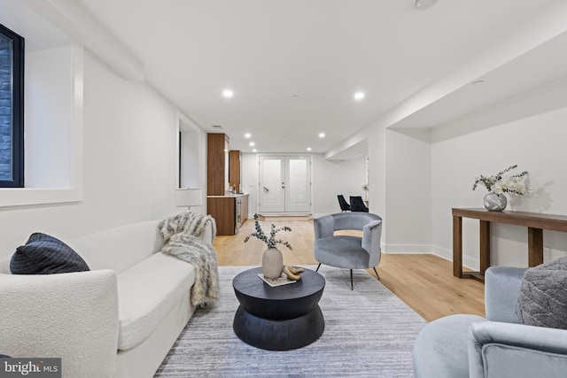 8206 Grubb Rd, Chevy Chase, MD 20815 - living area with light wood-type flooring, recessed lighting, and baseboards