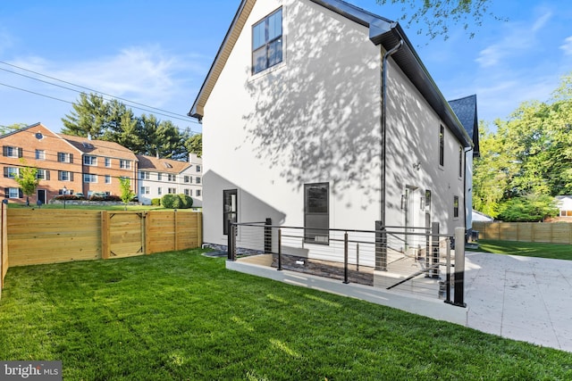 8206 Grubb Rd, Chevy Chase, MD 20815 - rear view of house with a patio area and stucco siding