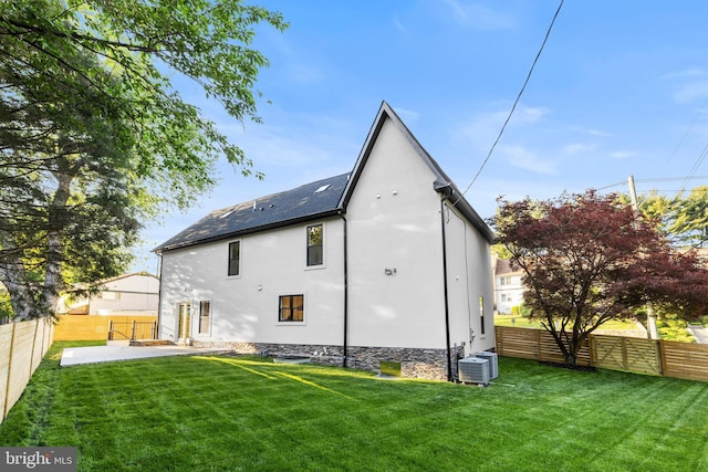 8206 Grubb Rd, Chevy Chase, MD 20815 - back of property featuring central AC, stucco siding, and a patio