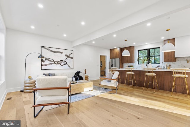 8206 Grubb Rd, Chevy Chase, MD 20815 - living area with light wood-type flooring, recessed lighting, and baseboards