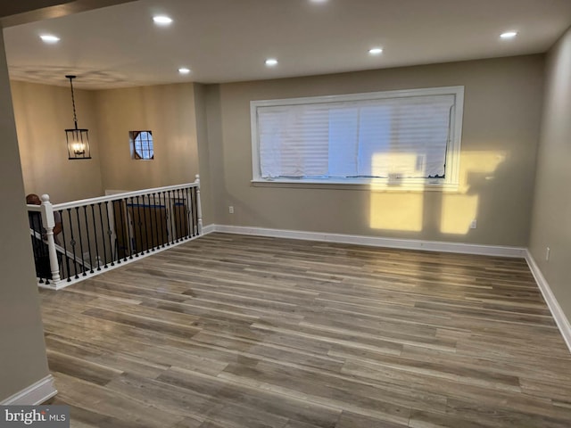 spare room with hardwood / wood-style flooring