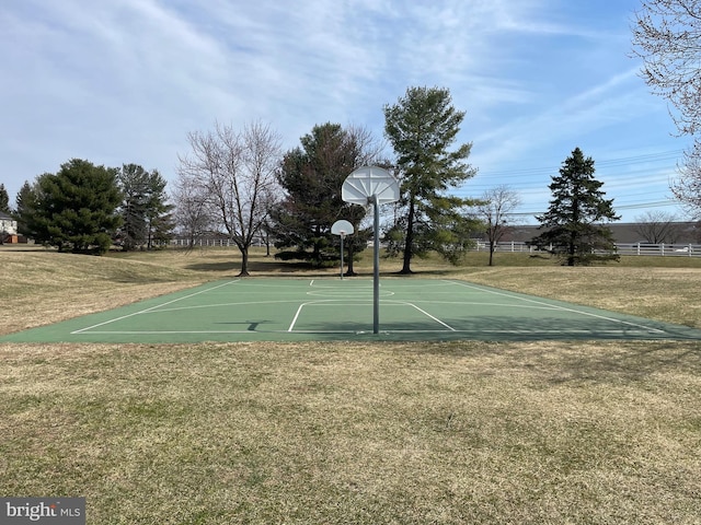 view of basketball court featuring a lawn and community basketball court