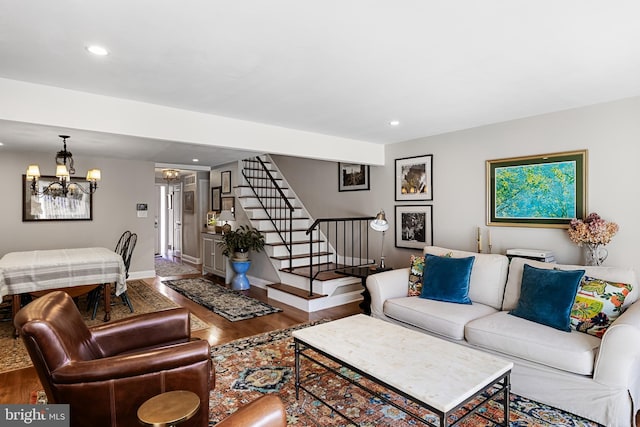 living room with a chandelier and hardwood / wood-style flooring