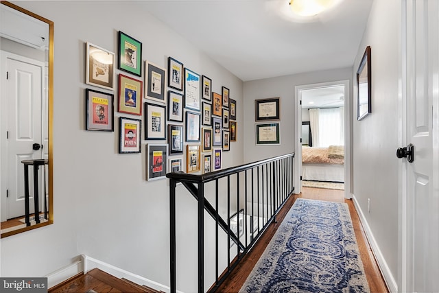 corridor with dark hardwood / wood-style floors