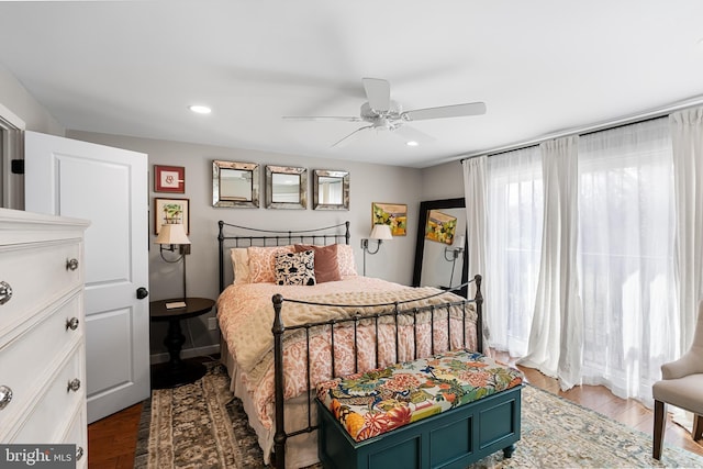 bedroom with hardwood / wood-style flooring and ceiling fan