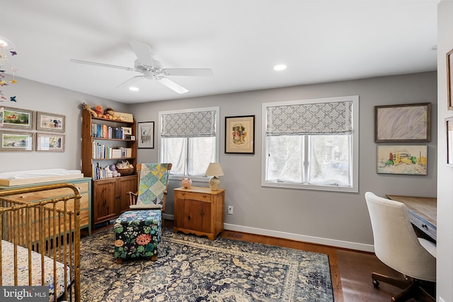 bedroom with dark hardwood / wood-style flooring and ceiling fan