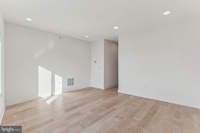 spare room with light hardwood / wood-style flooring