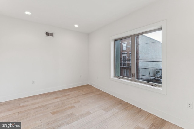 unfurnished room featuring light hardwood / wood-style flooring