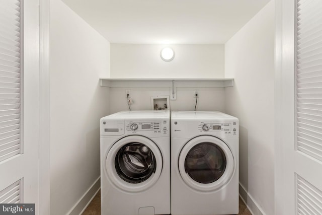 clothes washing area featuring washing machine and dryer