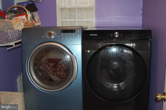 clothes washing area with independent washer and dryer