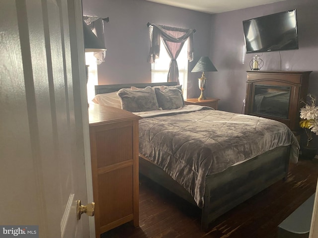 bedroom featuring dark wood-type flooring