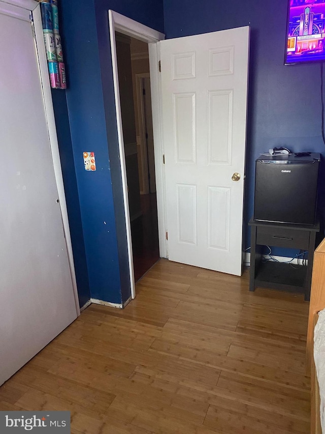 hallway featuring hardwood / wood-style floors