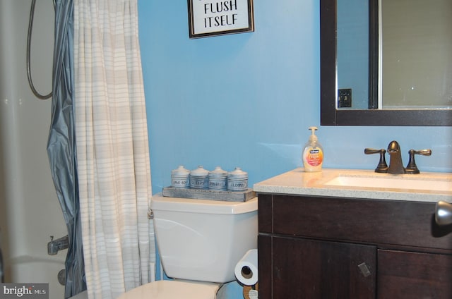 full bathroom with vanity, toilet, and shower / tub combo