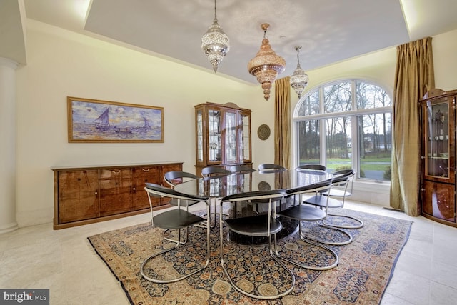 tiled dining room with a healthy amount of sunlight