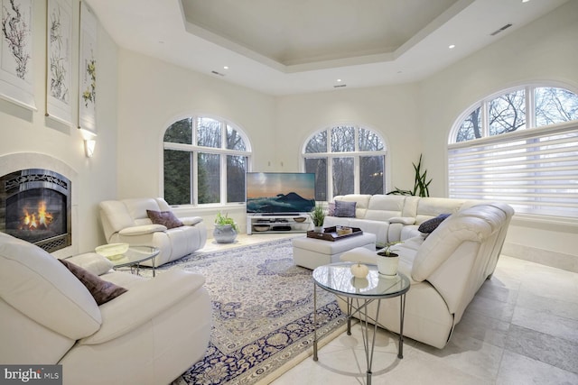 living room with a tray ceiling