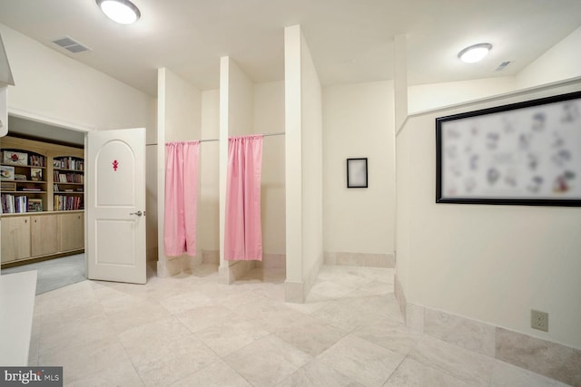 bathroom with vaulted ceiling