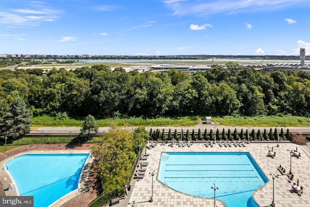 view of pool featuring a water view