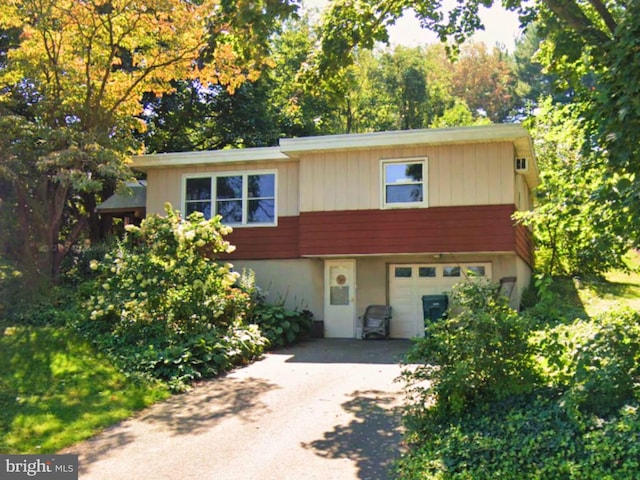 view of front of house featuring an attached garage and driveway