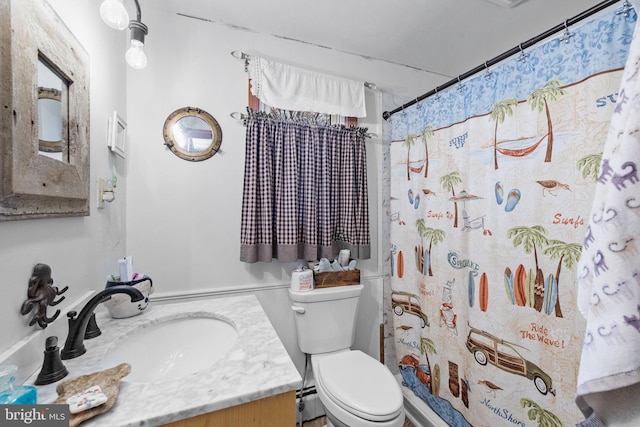 bathroom with vanity, a shower with shower curtain, toilet, and a baseboard heating unit