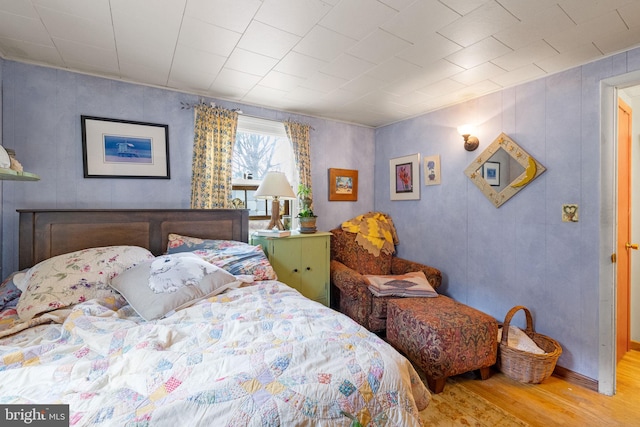 bedroom with wood finished floors