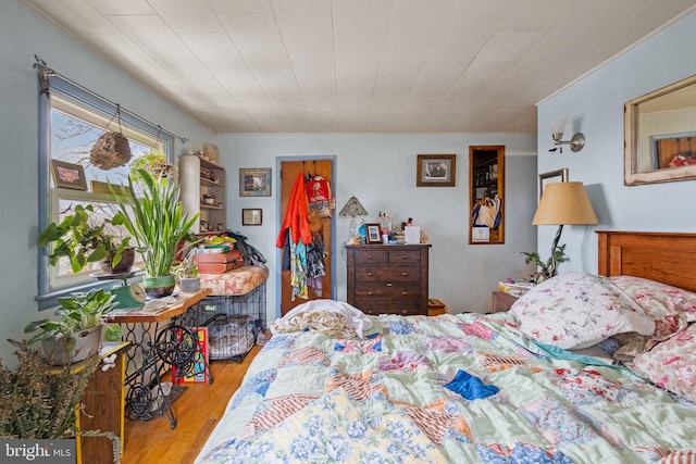 bedroom featuring wood finished floors