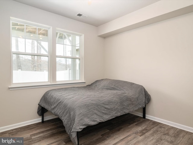 bedroom featuring dark hardwood / wood-style floors