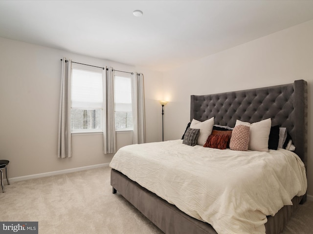 bedroom with light colored carpet