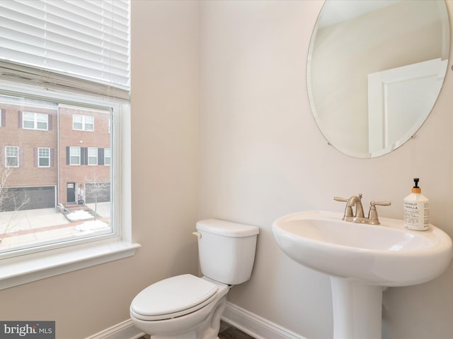 bathroom featuring sink and toilet