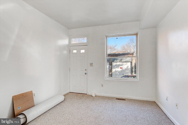 foyer with light carpet