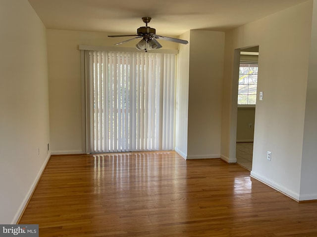 spare room featuring ceiling fan and hardwood / wood-style flooring