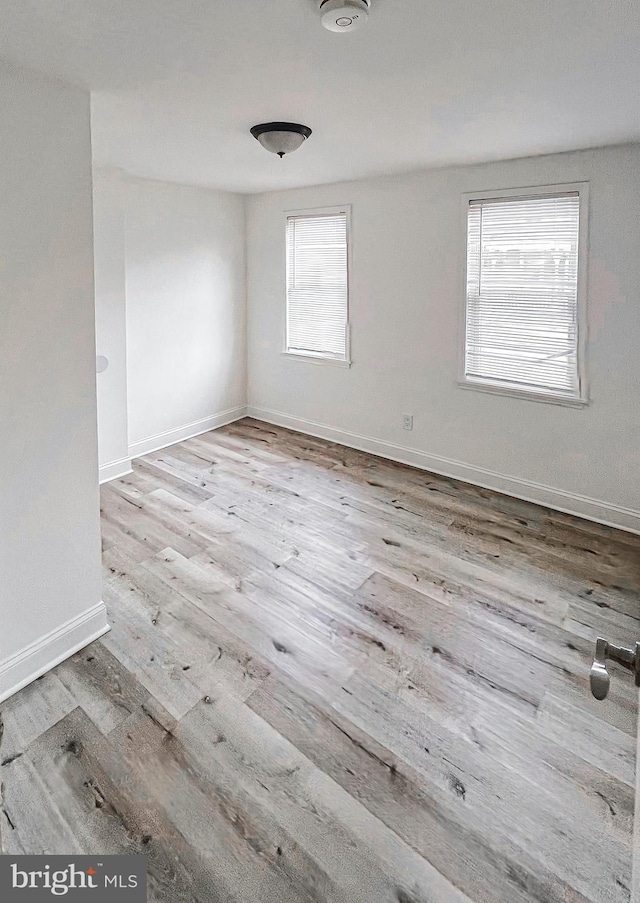 unfurnished room featuring light hardwood / wood-style floors