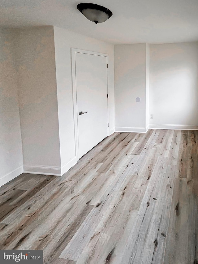 unfurnished room featuring light hardwood / wood-style floors