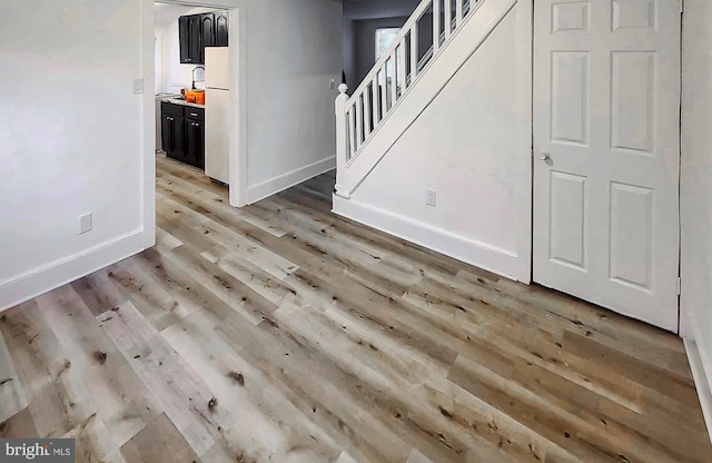 interior space featuring sink and light hardwood / wood-style floors