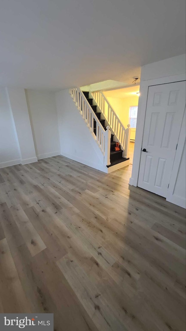 unfurnished room with hardwood / wood-style floors