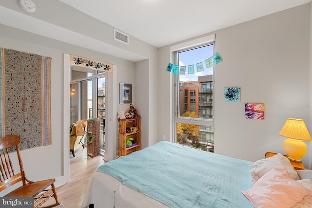 bedroom with light hardwood / wood-style floors