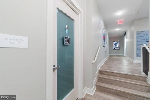 stairway featuring hardwood / wood-style floors