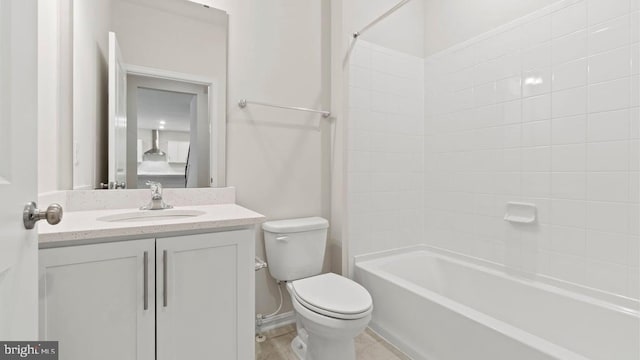 full bathroom featuring vanity, toilet, and washtub / shower combination