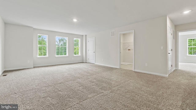 spare room with light colored carpet