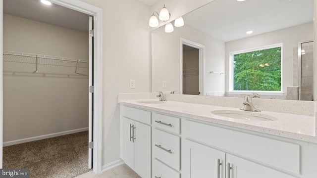 800 Long Meadow Dr, Fredericksburg, VA 22406 - full bathroom with double vanity, a spacious closet, tiled shower, and recessed lighting