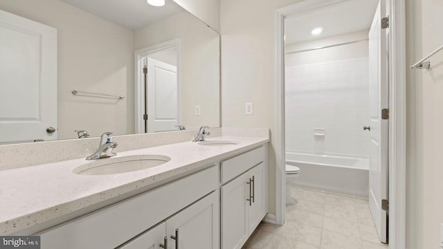 full bathroom featuring shower / tub combination, vanity, and toilet