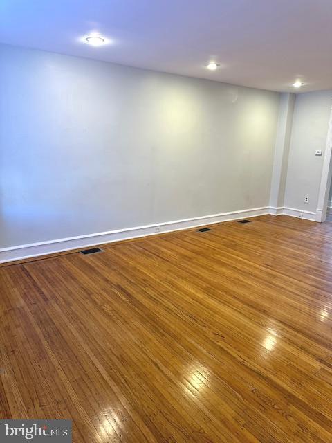 empty room featuring hardwood / wood-style flooring