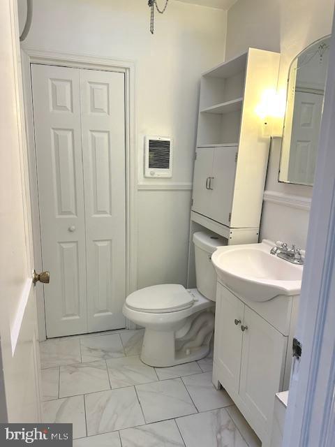 bathroom with vanity and toilet