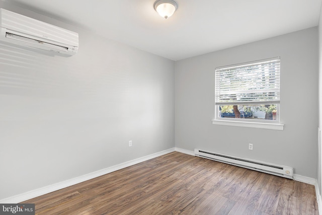 unfurnished room with a wall mounted AC, a baseboard radiator, and hardwood / wood-style flooring