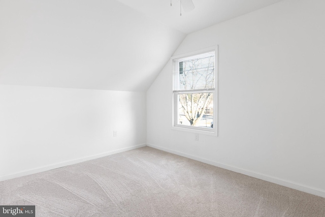 bonus room with carpet, ceiling fan, and vaulted ceiling